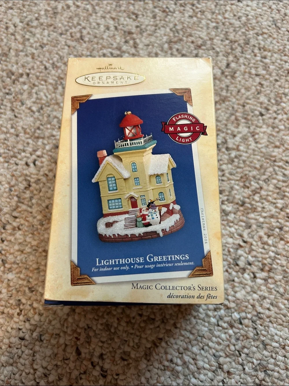 2004 Hallmark Lighthouse Greetings Ornament with flashing magic light.